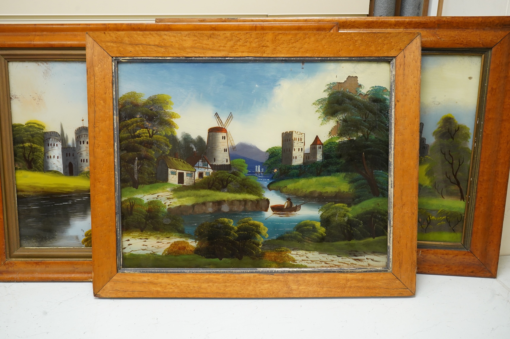 Victorian School, four reverse glass painted panels, Riverscapes, largest 39 x 60cm